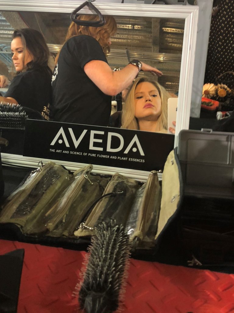 fashion blogger getting hair done backstage at aveda at NYFW