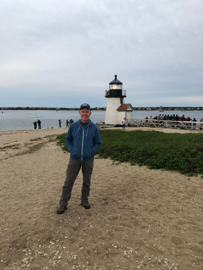 Dad in Nantucket in front of lighthouse
