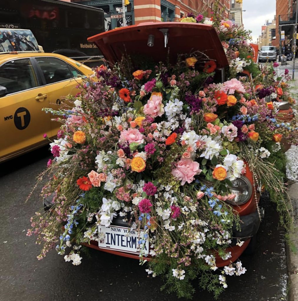 vintage car overflowing with flowers
