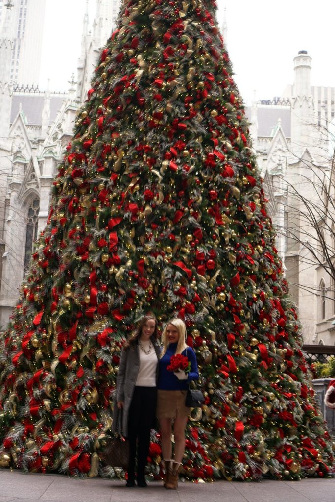 friends in front of the Lotte New York Palace Christmas tree