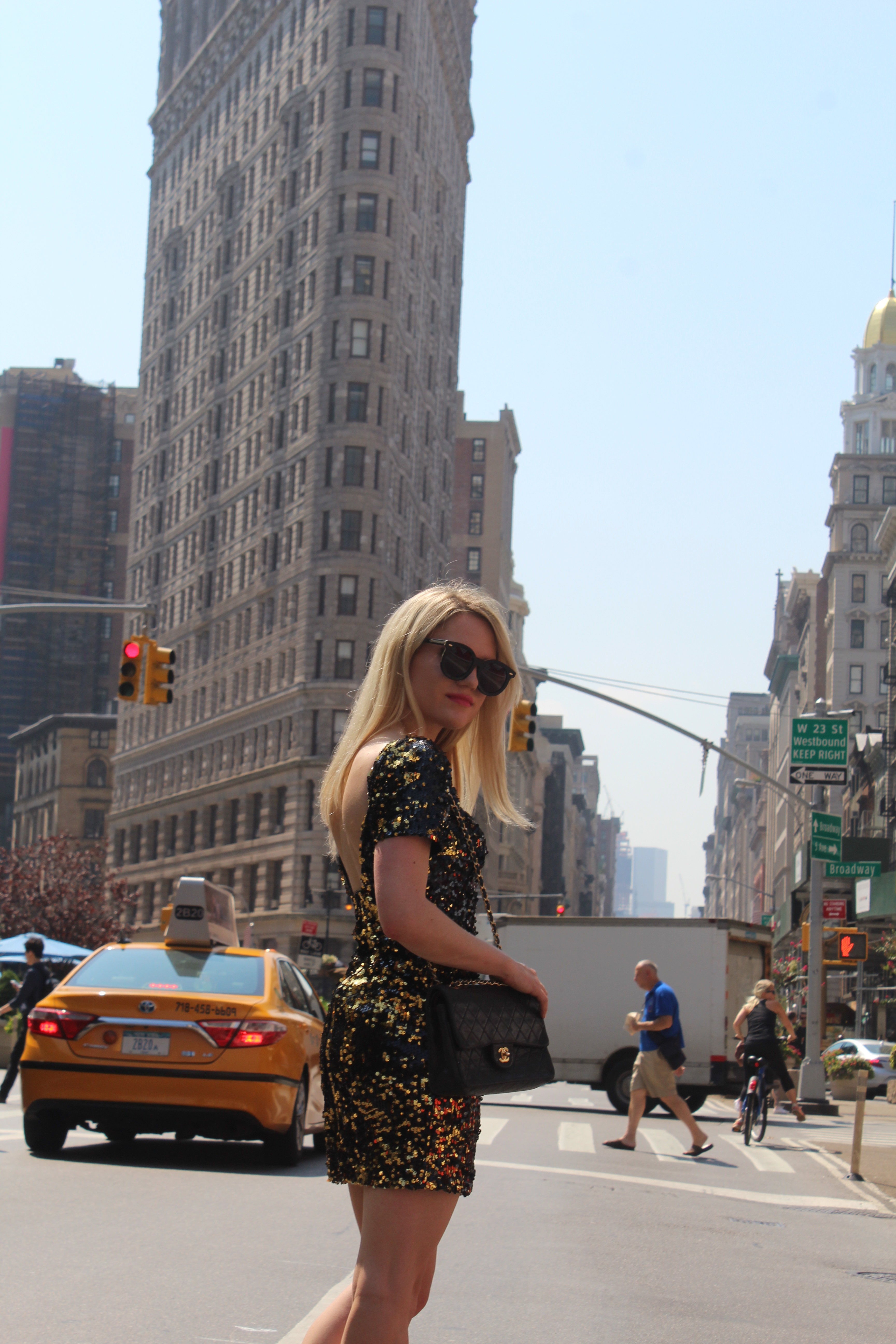 Caitlin Hartley of Styled American black and gold sequin dress