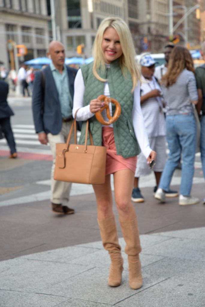 green vest, coral skirt, tan tote bag