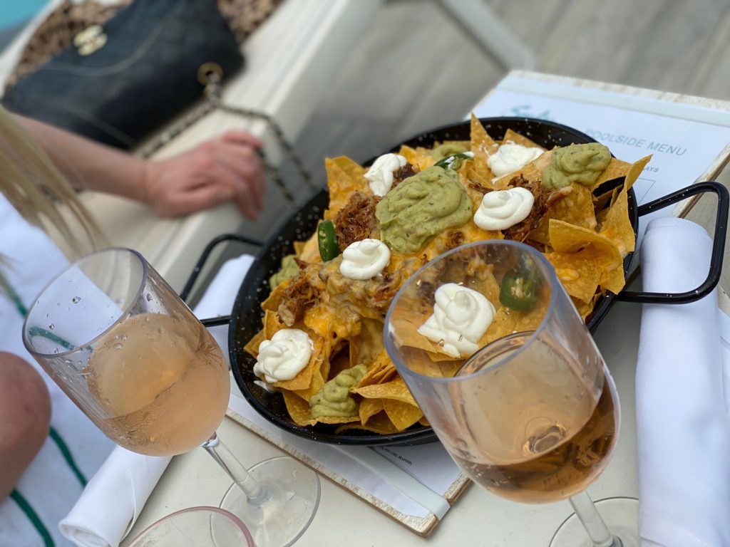 nachos and rose by the pool
