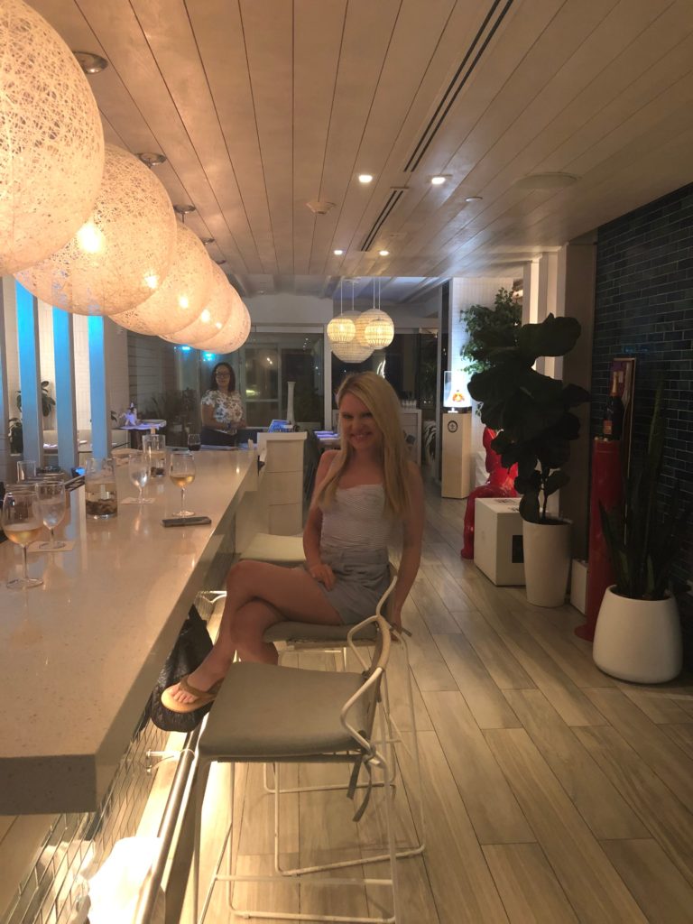 blogger at hotel bar at Serafina Beach Hotel San Juan